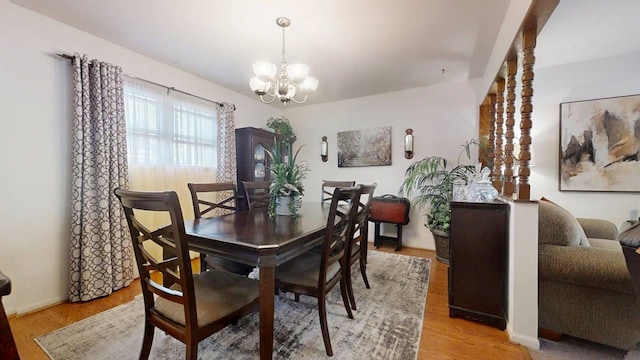1309 Eureka St, Urbana, IL 61801 - dining area with a chandelier and light wood-style flooring