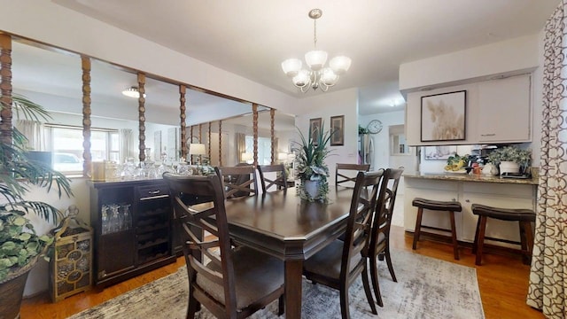 1309 Eureka St, Urbana, IL 61801 - dining room featuring a chandelier and light wood finished floors