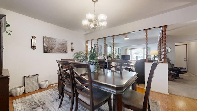 1309 Eureka St, Urbana, IL 61801 - dining area featuring light wood-style flooring and a chandelier
