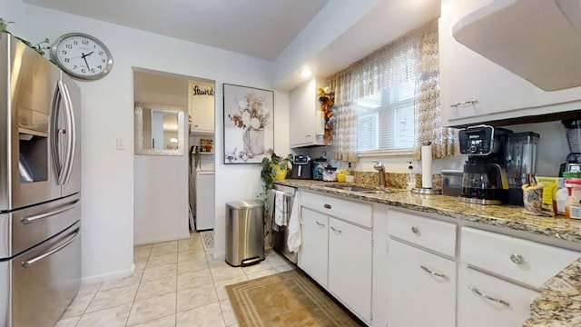 1309 Eureka St, Urbana, IL 61801 - kitchen with appliances with stainless steel finishes, a sink, white cabinets, light stone counters, and light tile patterned floors