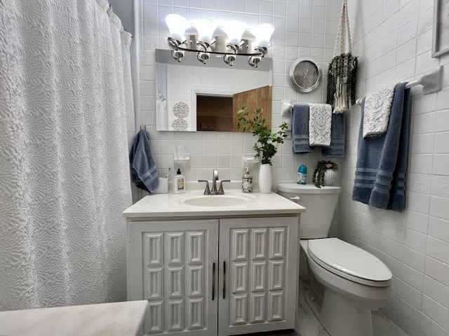 1309 Eureka St, Urbana, IL 61801 - full bathroom featuring tile walls, toilet, tasteful backsplash, and vanity