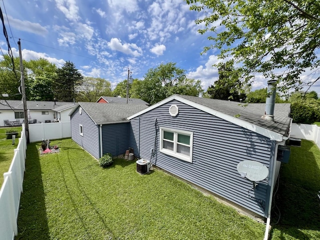 1309 Eureka St, Urbana, IL 61801 - back of house featuring a shingled roof and cooling unit