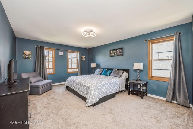 bedroom with carpet floors and baseboards