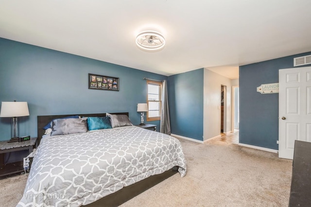 bedroom with carpet floors and baseboards