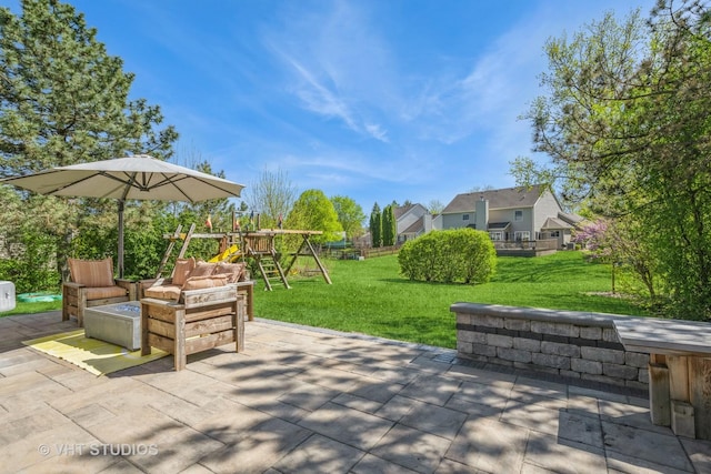view of patio / terrace with a playground and an outdoor living space