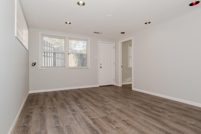 15413 Dobson Ave, Dolton, IL 60419 - unfurnished room with baseboards, recessed lighting, wood finished floors, and visible vents