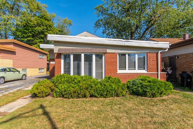 15413 Dobson Ave, Dolton, IL 60419 - view of property exterior featuring a lawn and brick siding