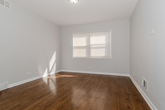 15413 Dobson Ave, Dolton, IL 60419 - spare room with baseboards, wood finished floors, and visible vents