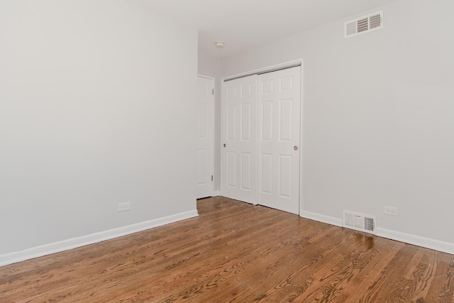 15413 Dobson Ave, Dolton, IL 60419 - unfurnished room with visible vents, baseboards, and wood finished floors