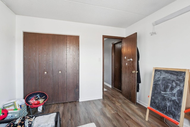 7310 Tiffany Dr Unit 2B, Orland Park, IL 60462 - bedroom featuring baseboards and wood finished floors