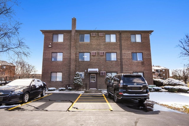 7310 Tiffany Dr Unit 2B, Orland Park, IL 60462 - snow covered property with uncovered parking
