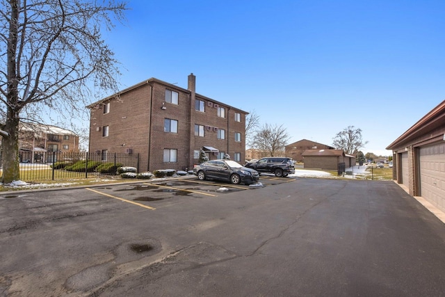 7310 Tiffany Dr Unit 2B, Orland Park, IL 60462 - uncovered parking lot with fence