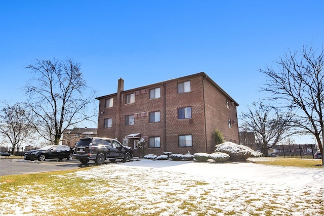 7310 Tiffany Dr Unit 2B, Orland Park, IL 60462 - snow covered building with uncovered parking