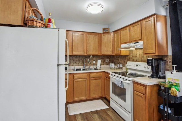 7310 Tiffany Dr Unit 2B, Orland Park, IL 60462 - kitchen featuring white appliances, light countertops, under cabinet range hood, tasteful backsplash, and a sink