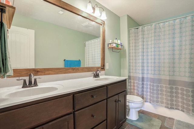bathroom with toilet, shower / bath combo, double vanity, and a sink