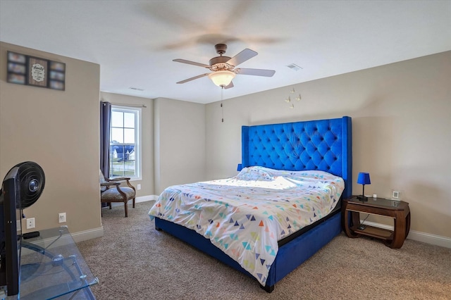 carpeted bedroom featuring visible vents, baseboards, and ceiling fan