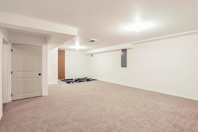 finished basement featuring baseboards, carpet floors, and electric panel