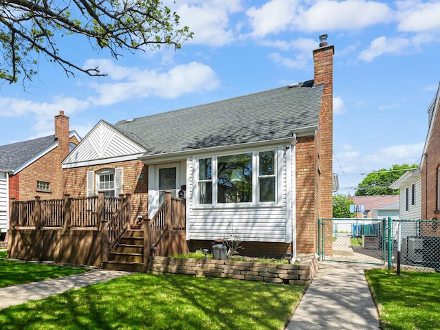 11321 S Drake Ave, Chicago, IL 60655 - view of front of property featuring fence, a gate, central AC, and a front lawn