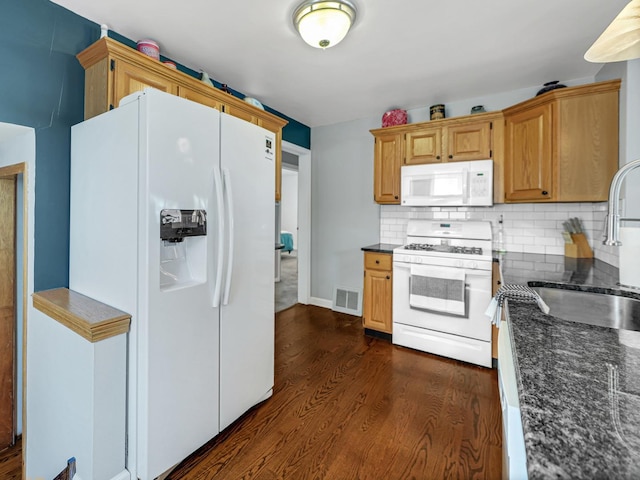 11321 S Drake Ave, Chicago, IL 60655 - kitchen featuring visible vents, tasteful backsplash, a sink, white appliances, and dark wood-type flooring
