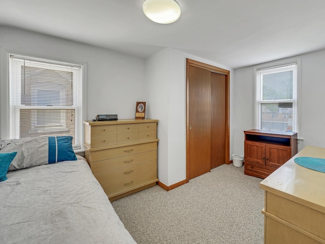 11321 S Drake Ave, Chicago, IL 60655 - bedroom featuring baseboards, light colored carpet, and a closet