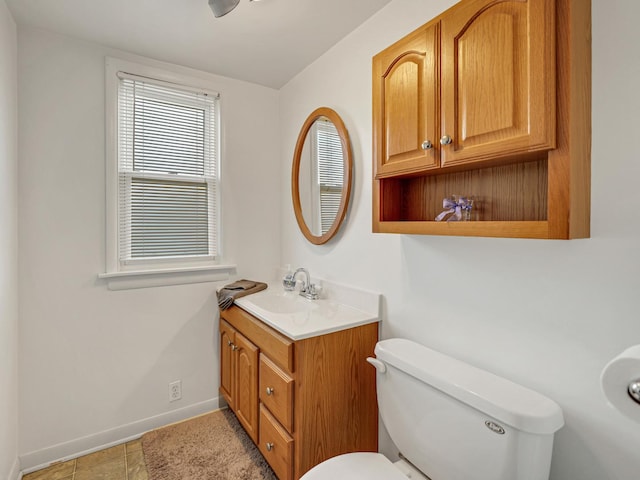 11321 S Drake Ave, Chicago, IL 60655 - bathroom with toilet, baseboards, tile patterned flooring, and vanity
