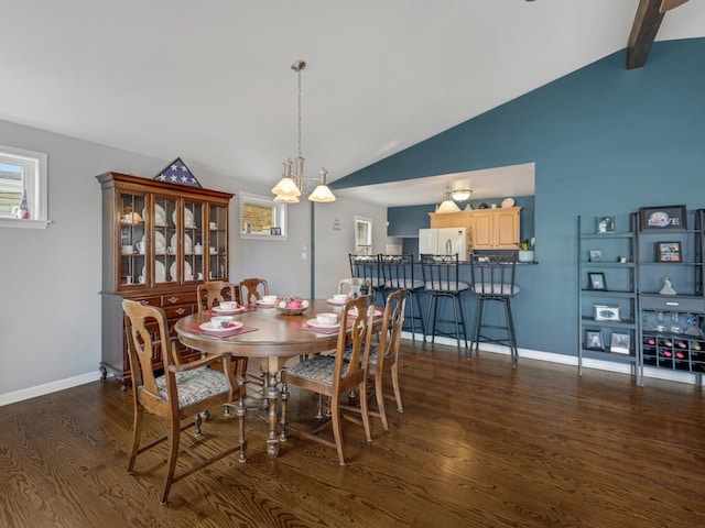 11321 S Drake Ave, Chicago, IL 60655 - dining space with baseboards, wood finished floors, and lofted ceiling