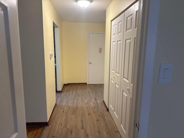 8901 N Western Ave Unit 116, Des Plaines, IL 60016 - corridor featuring baseboards and wood finished floors