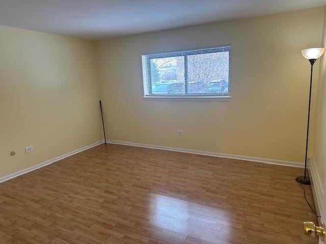 8901 N Western Ave Unit 116, Des Plaines, IL 60016 - empty room featuring baseboards and wood finished floors