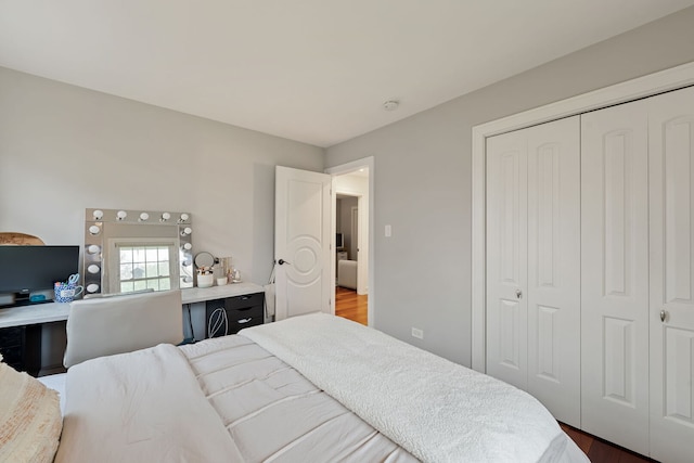 bedroom with a closet and wood finished floors