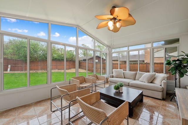 sunroom featuring ceiling fan and outdoor lounge area