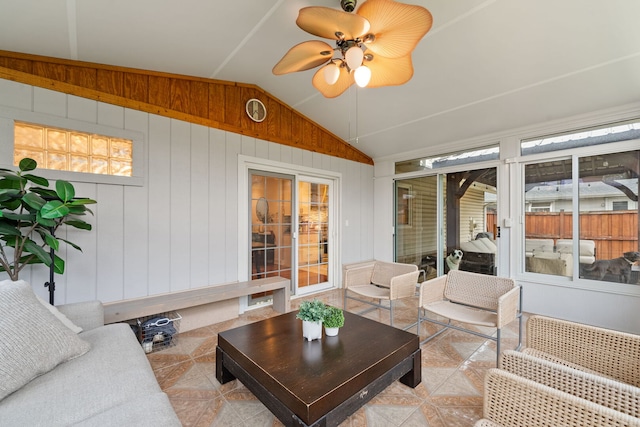 sunroom / solarium with a ceiling fan and an outdoor hangout area