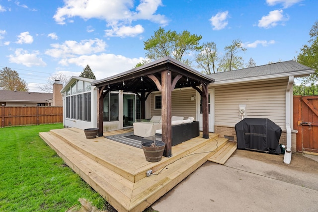 deck with a yard, fence, a gazebo, and outdoor lounge area