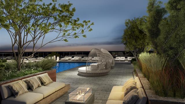 pool with an outdoor living space and a patio area