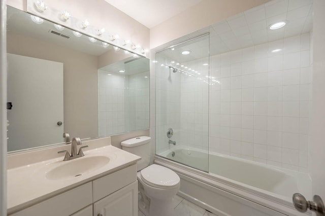 bathroom with toilet, visible vents, shower / bath combination with glass door, tile patterned flooring, and vanity
