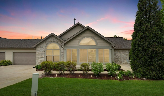 2715 J T Coffman Dr Unit 2715, Champaign, IL 61822 - single story home featuring stone siding, concrete driveway, a yard, an attached garage, and a shingled roof