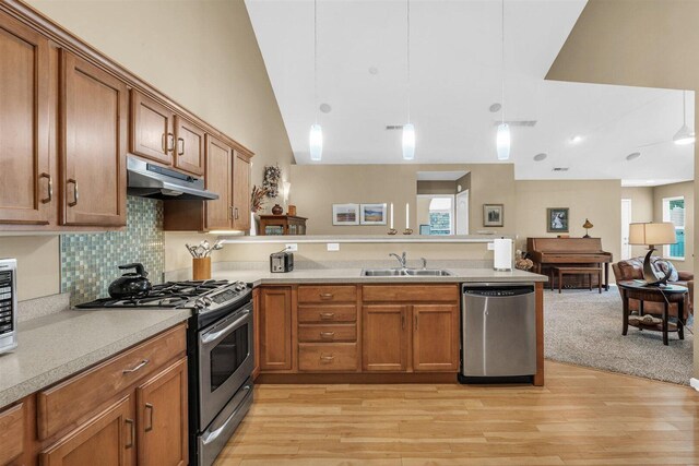 2715 J T Coffman Dr Unit 2715, Champaign, IL 61822 - kitchen featuring appliances with stainless steel finishes, under cabinet range hood, a peninsula, a sink, and open floor plan