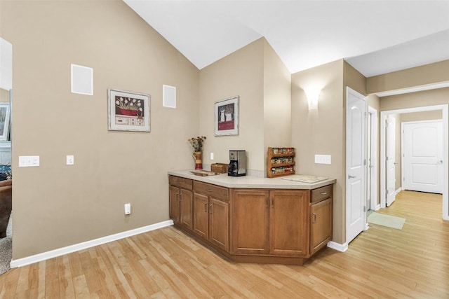 2715 J T Coffman Dr Unit 2715, Champaign, IL 61822 - bar area featuring light wood finished floors, baseboards, and vaulted ceiling