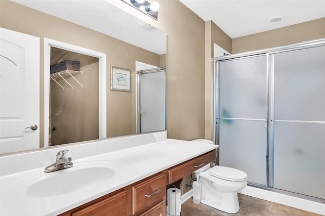 2715 J T Coffman Dr Unit 2715, Champaign, IL 61822 - bathroom featuring a shower stall, toilet, vanity, and tile patterned floors