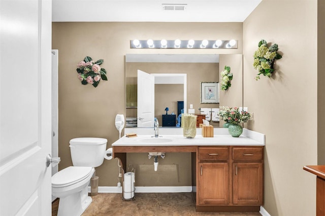 2715 J T Coffman Dr Unit 2715, Champaign, IL 61822 - bathroom featuring toilet, baseboards, and vanity