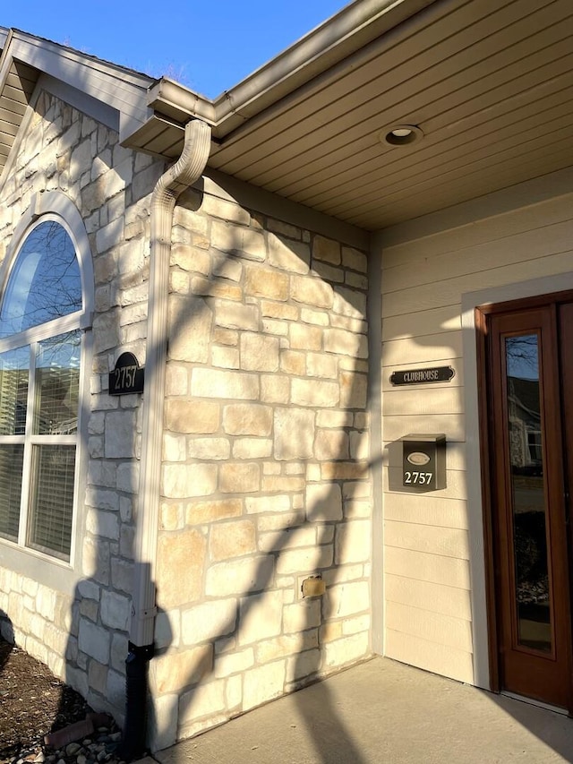 2715 J T Coffman Dr Unit 2715, Champaign, IL 61822 - doorway to property with stone siding