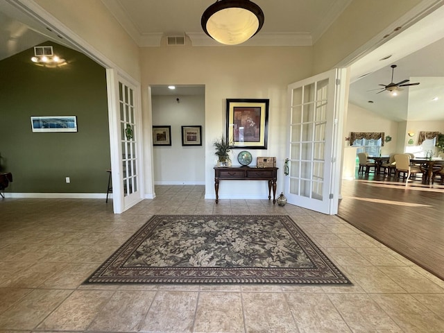 2715 J T Coffman Dr Unit 2715, Champaign, IL 61822 - tiled foyer with french doors, crown molding, baseboards, and a ceiling fan