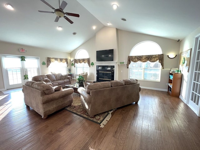2715 J T Coffman Dr Unit 2715, Champaign, IL 61822 - living room with a ceiling fan, high vaulted ceiling, a fireplace, wood finished floors, and baseboards