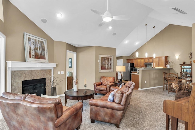 2715 J T Coffman Dr Unit 2715, Champaign, IL 61822 - living room featuring ceiling fan, high vaulted ceiling, a fireplace, light carpet, and baseboards
