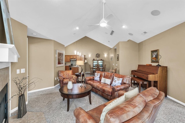 2715 J T Coffman Dr Unit 2715, Champaign, IL 61822 - living area with a fireplace, baseboards, ceiling fan, high vaulted ceiling, and light colored carpet
