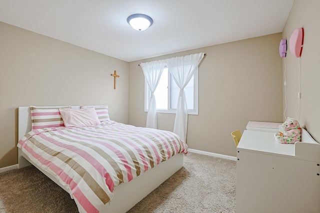 bedroom featuring baseboards and light colored carpet