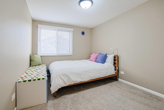 bedroom with baseboards and carpet floors