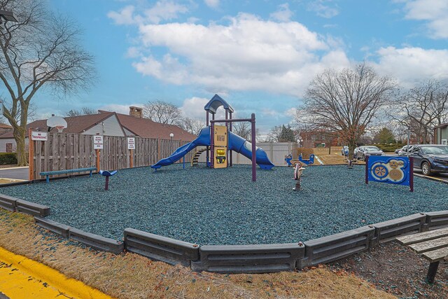 communal playground featuring fence