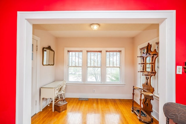 miscellaneous room featuring light wood finished floors and baseboards