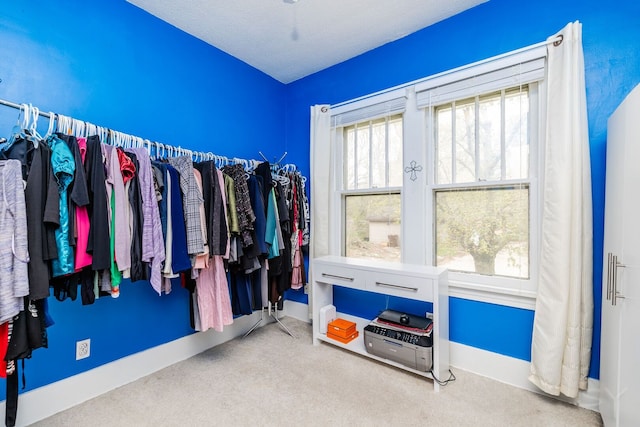 spacious closet with carpet floors
