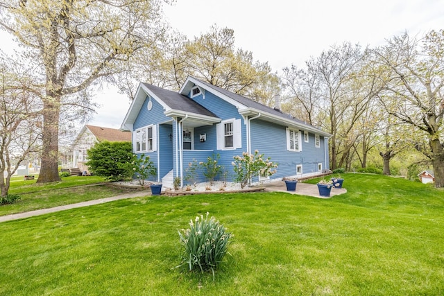 view of front of property with a front lawn and a patio